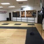 Emmons Taekwondo - A TaeKwonDo academy with a black mat.